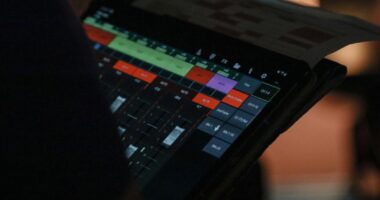 a close up of a person holding a tablet