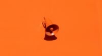 orange megaphone on orange wall