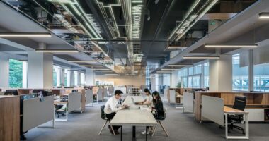 man and woman sitting on table