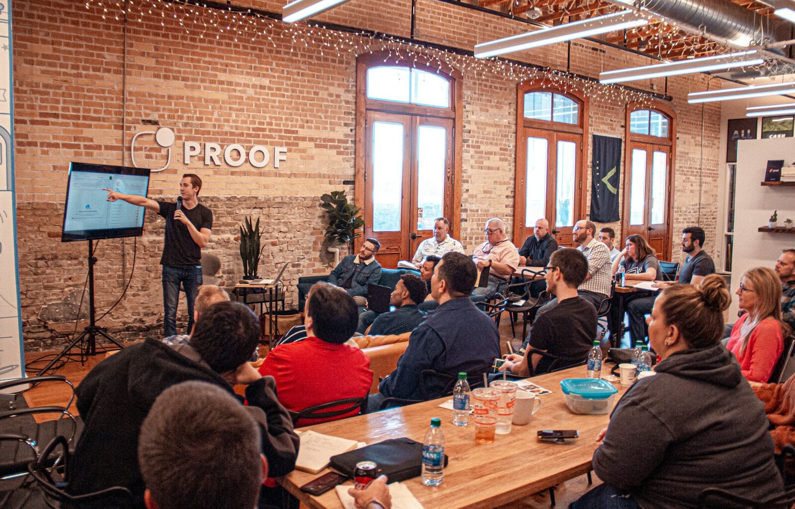 people sitting on chair in front of table
