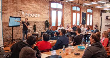 people sitting on chair in front of table